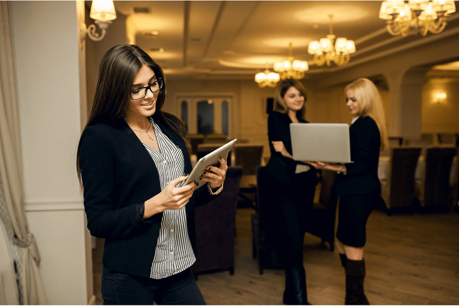 Welcome desk ushers greeting event attendees